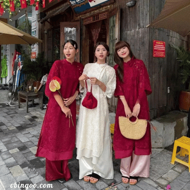 Áo dài lông vũ buộc nơ cách điệu